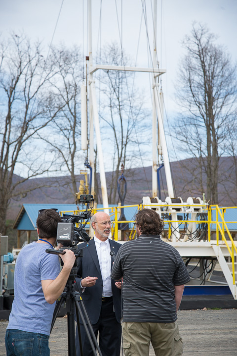 With the ETEC rig as the backdrop, a film crew conducts an interview with the governor.