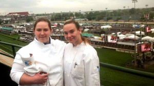 Penn College students Brianna R. Helmick, a culinary arts and systems student from Hershey, and Eileen N. Harrington, of Etters, who received an associate degree in hospitality management and is continuing her studies toward a bachelor’s degree in technology management, pause above the iconic Churchill Downs track during the 2014 Kentucky Derby.