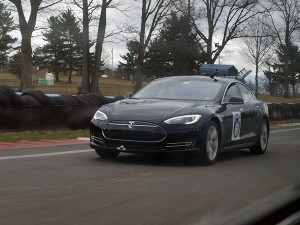 Wearing a Wildcat logo, the Tesla S Model takes to the highway.