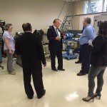 C. Hank White, director of the PIRC, answers a question in the extrusion lab. 