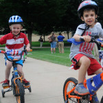 A patriotic pair test their training wheels.
