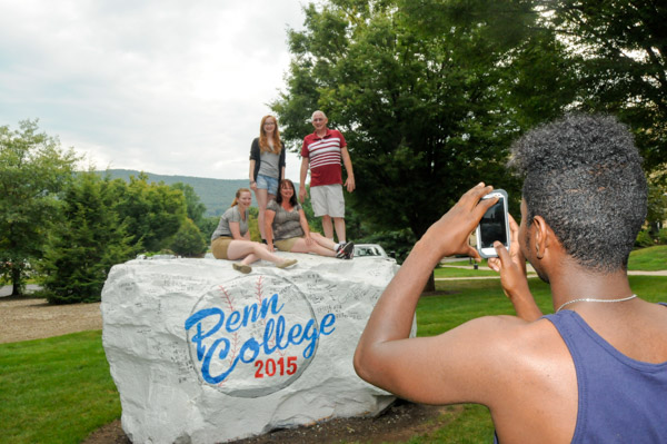 Andrew A. Smith takes a photo at