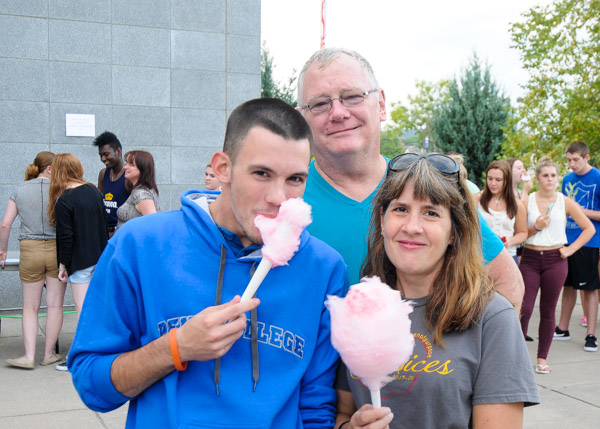 Enjoying the carnival atmosphere are Patrick C. Frazier, an automotive technology: Honda PACT emphasis student from Nazareth, and his parents.