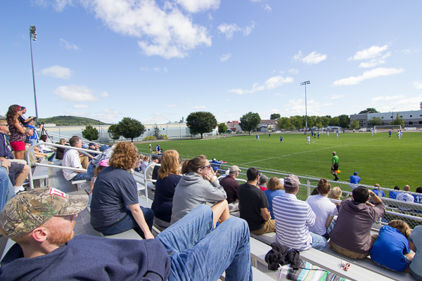 Soccer fans gather under a sky of Wildcat blue.