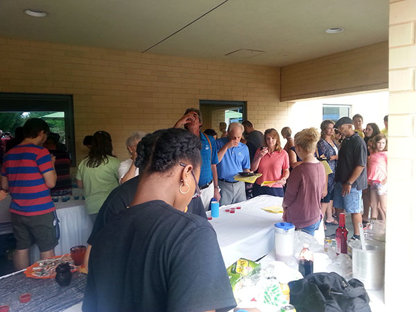 Weekend visitors sample nonalcoholic drinks on the Bush Campus Center Patio in a School of Business & Hospitality mixology tasting and demonstration.