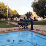 Members of the Blue Crew, supervised by General Services' Gary T. Pandolfi, form a school-spirited bucket brigade. (Photo by Allison A. Bressler)