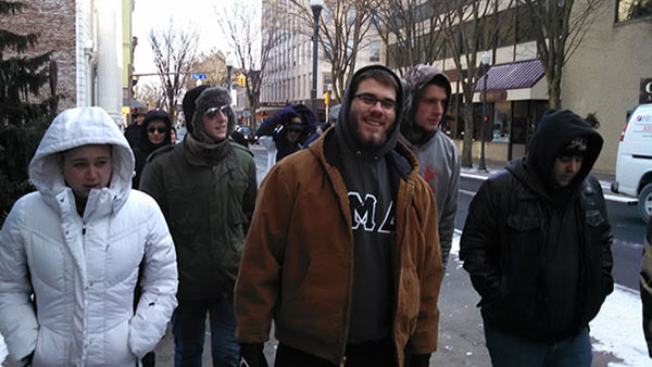 Newly elected Lock Haven City Councilwoman Sara Stringfellow walks with members of Penn College’s Phi Mu Delta fraternity.
