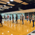 In the accomplished hands (and feet) of their instructors, students surrender to the liberating and passionate rhythm of salsa music.