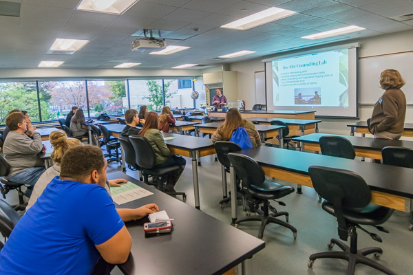 Faculty members Susan Slamka (left) and Deb Q. Bechdel talk about the college's human services majors.