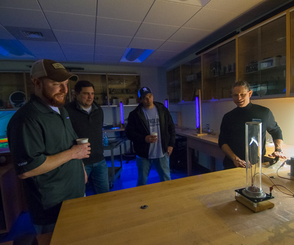 Joseph E. LeBlanc (right), assistant professor of physics, exhibits the fun side of science at the