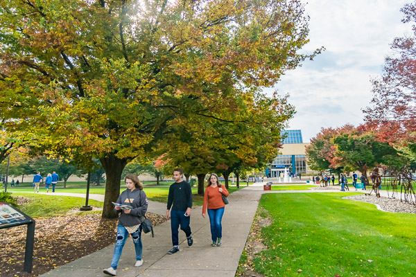 Seasonal foliage frames Open House visitors as they head north along the campus mall.