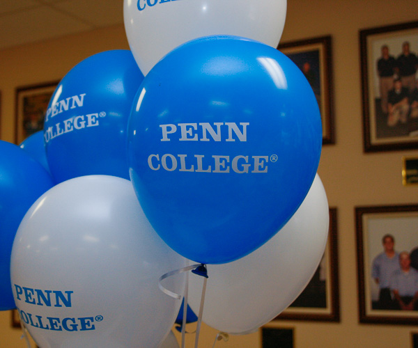 Penn College balloons are among the festive décor welcoming visitors to the Field House.