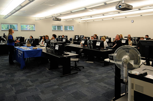 Jennifer I. Watson, coordinator of transfer initiatives, meets in Madigan Library with visitors interested in coming to Penn College from other institutions. Seated at left background is Ashley R. Murphy, director of admissions.