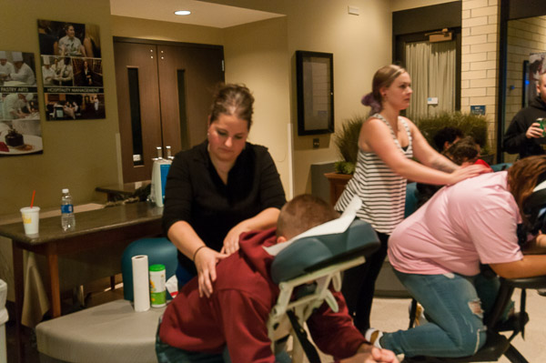 Masseuses ply their panic-reduction handiwork.