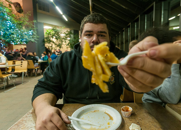 Ty J. Hewett, an automotive technology student from York, shows off his pancakes at Midnight Breakfast.