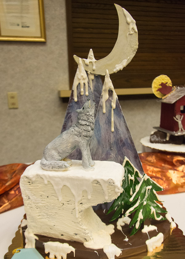 A canine howls in the moonlight on an honorable mention-earning sculpture by Sarah I. Tielmann.