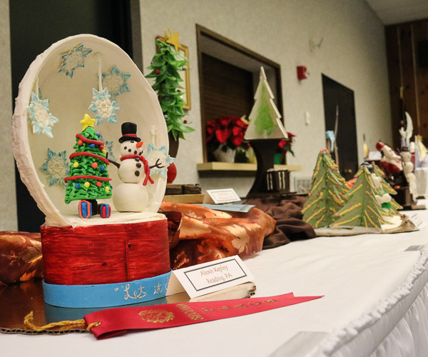 A long line of chocolate sculptures makes a grand show for high school and campus visitors.