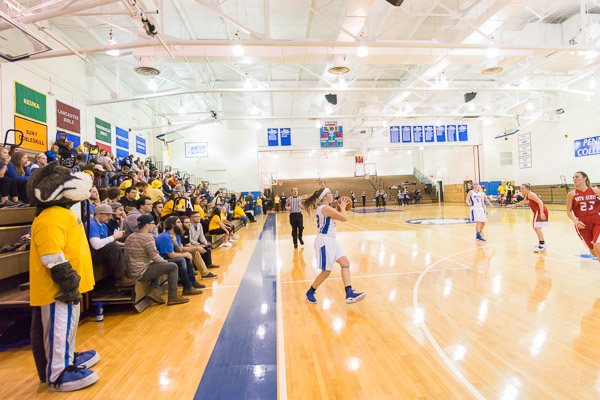 The Penn College mascot watches the game while observing the bigger picture.