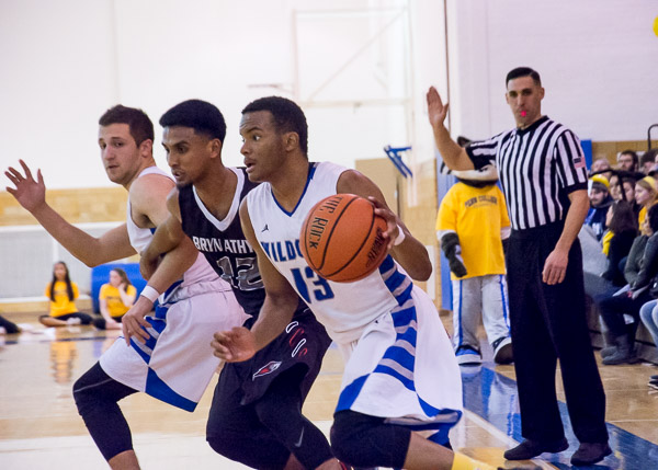 Erik L. Perry Jr., of Waldorf, Md., moves the ball downcourt.