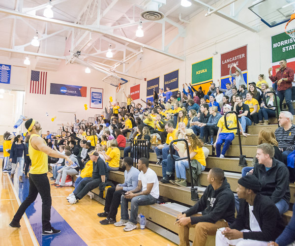 Game-night assistants launch swag onto a golden, supportive sea.