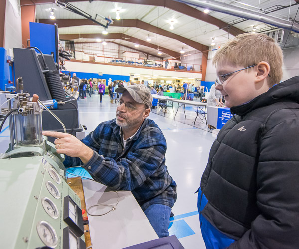 Christopher H. Van Stavoren, assistant professor in automotive, gives one-on-one attention to a potential technician.
