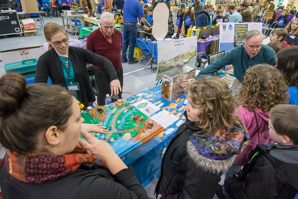 A crowd gathers around the Lycoming County Conservation District's