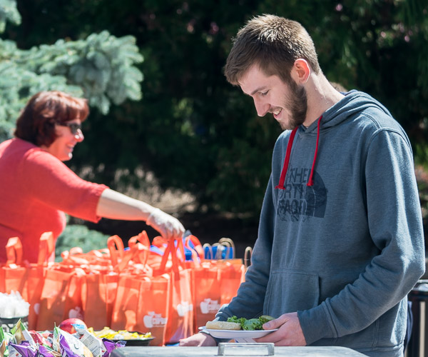 A student enjoys a meal with a message.