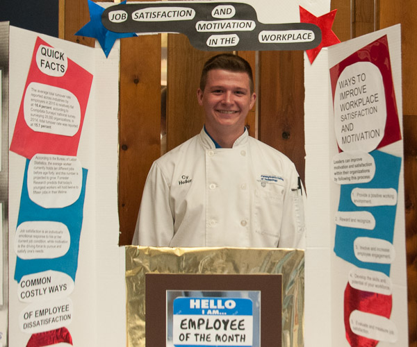 Heller presents his capstone research: “Job Satisfaction and Motivation in the Workplace.”