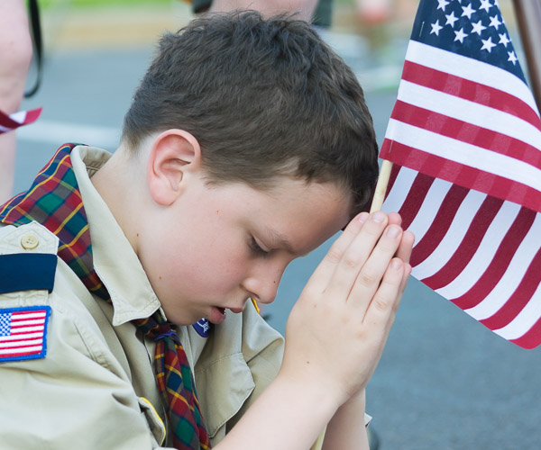 Albert Campbell, one of a crowd of Scouts in attendance, shows his reverence.
