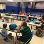 Crosscutters pitcher Kyle Young (left) and catcher James Lovett (since traded to the Arizona League's Seattle Mariners club) talk with campers in the college Field House ...