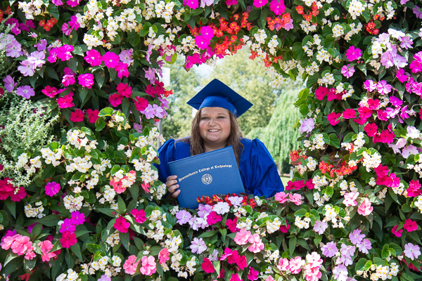 Stunningly framed on campus following the ceremony is Cynthia M. Wilt, of Hughesville, a surgical technology graduate.
