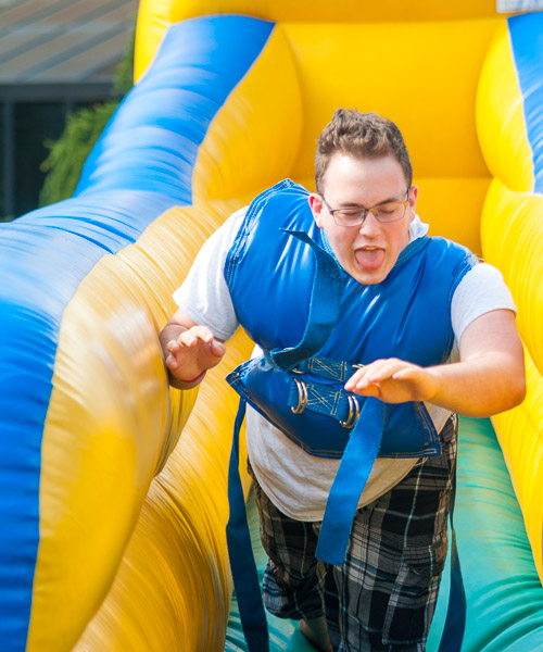 A midway atmosphere provides a challenging blend of fun, skill and strength.