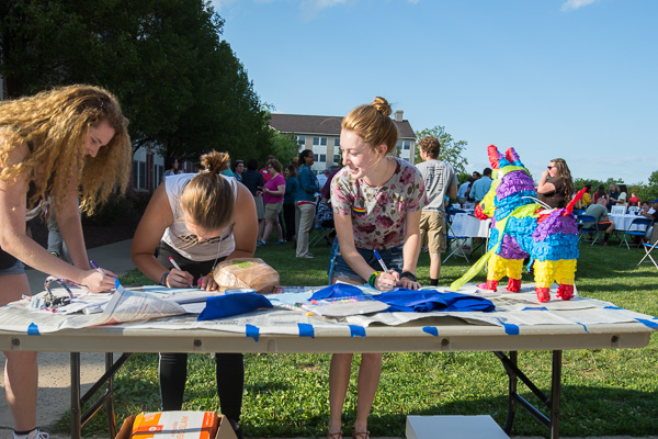 Students delight in creating personal fabric pieces – patches that reflect a campus organization, department, culture, etc. – for a representative quilt that will be sewn and displayed at the college.