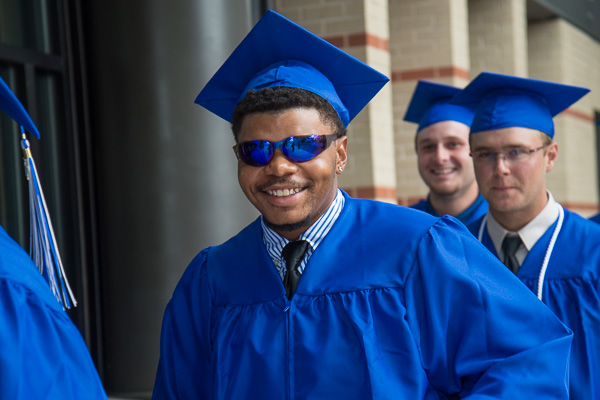 Titus B. Green's Wildcat Blue sunglasses and a self-assured smile are the perfect fashion accessories for summer commencement. Green, of Glenside, graduated in collision repair technology.