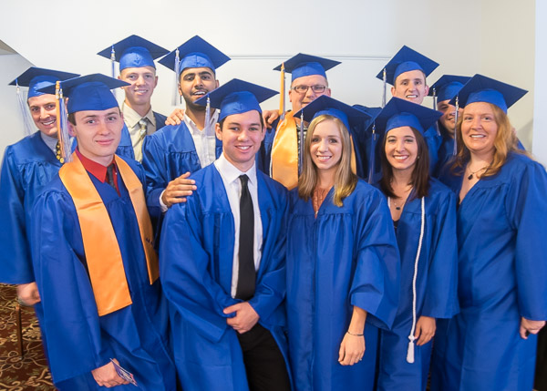 Primped and primed, soon-to-be-alumni gather in a Genetti Hotel ballroom.