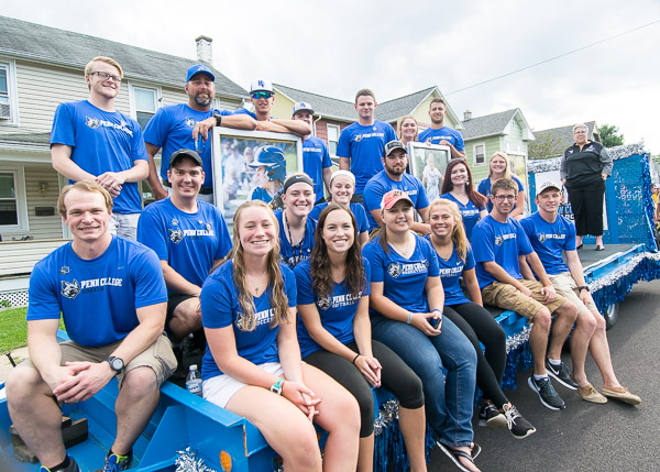 Wildcat athletes, coaches and the college president ride into a new era of NCAA membership.