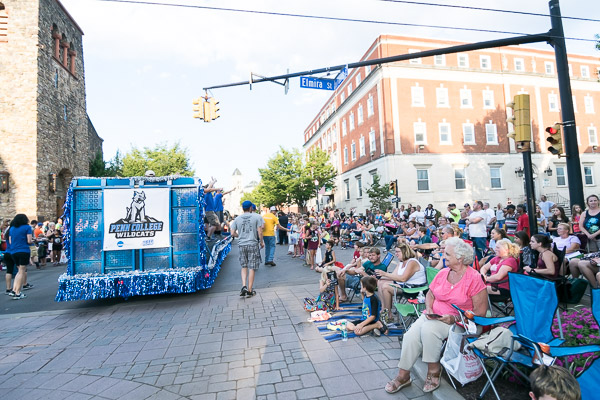 The college float travels into the 300 block of West Fourth Street ...