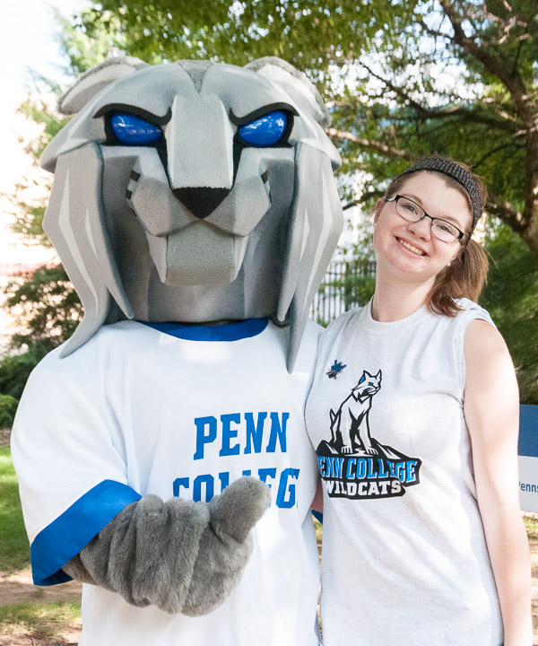 The Wildcat (represented at the event by Kayla M. Jackson, an applied health studies major) joins another student leader, Cassandra D. Henderson, enrolled in business administration: banking and finance concentration, on a high-profile stroll.