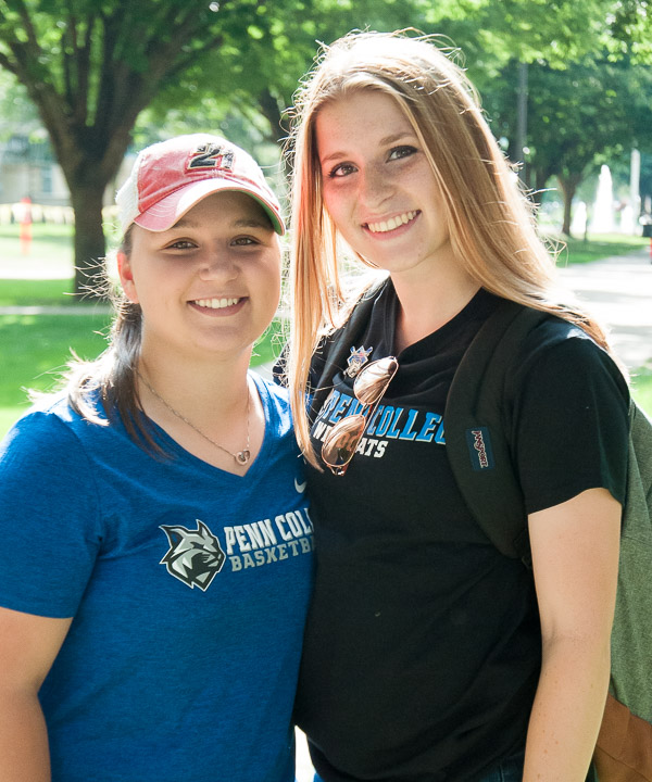 Basketball teammates Madeline P. Wenk (left) and Erin N. Shaffer add to the day's sunshine.