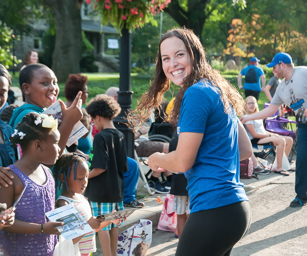 Softball player Taylor A. Krow proves equally at ease in the parade crowd as she is in the outfield.