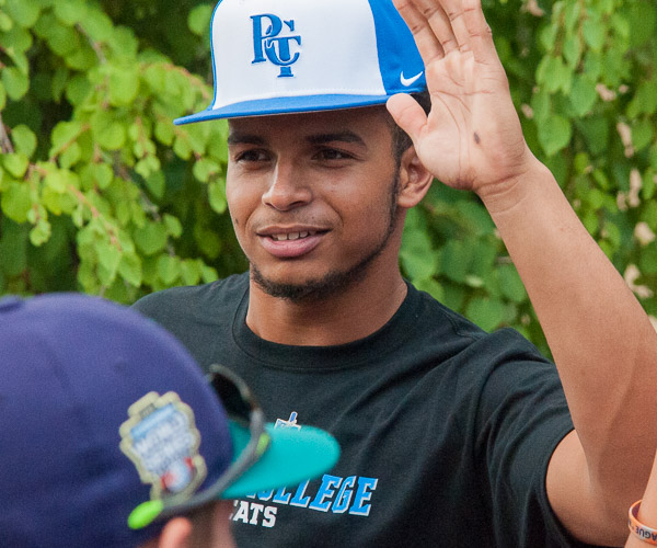 Luis Rodriguez, of The Bronx, N.Y., greets the Europe-Africa team from Emilia, Italy.