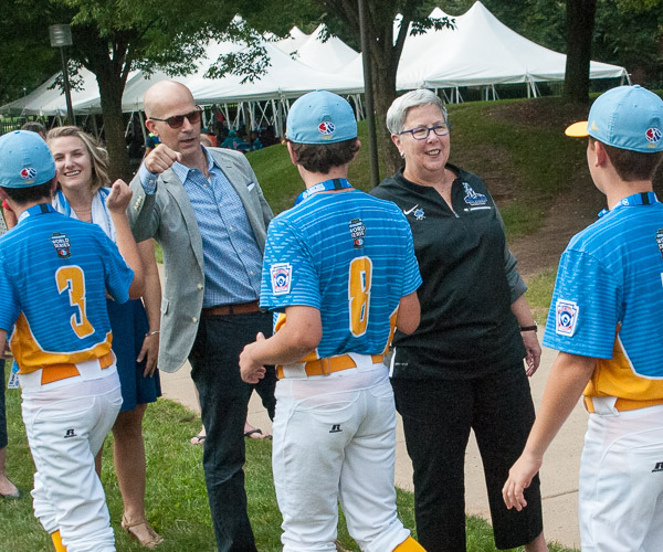 Penn College President Davie Jane Gilmour (right) welcomes players from Rancho Santa Margarita, Calif., representing the West region. Joining her are Loni N. Kline, vice president for institutional advancement, and Patrick Marty, vice president for college relations.