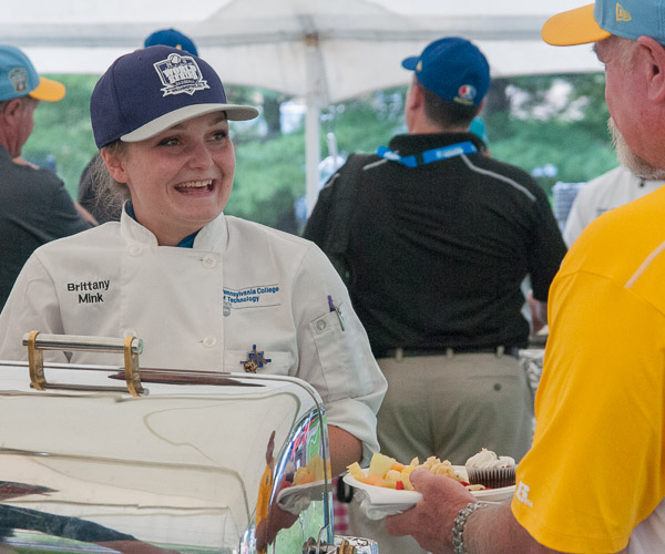 Brittany L. Mink, an applied management student and baking and pastry arts grad from Allentown, serves macaroni and cheese.