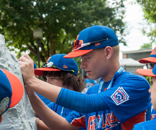 Great Lakes reps honor a pre-parade tradition by signing The Rock.