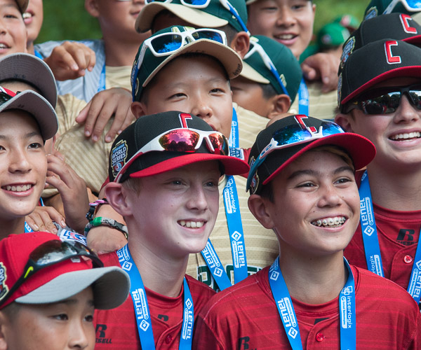 Teams mingle for a cross-cultural photo, with players representing Tokyo, Japan; Seoul, South Korea; and White Rock, British Columbia, Canada.
