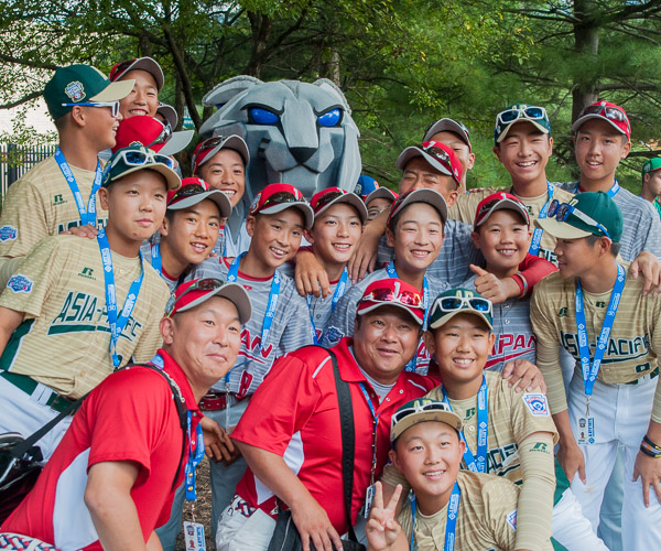 The Asia-Pacific and Japan teams gather around the Wildcat.