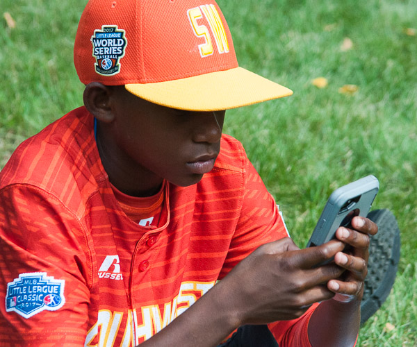 A player on the Southwest team, from Lufkin, Texas, finds respite.