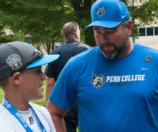 Penn College head baseball coach Chris Howard, who spent a great deal of time in Washington as catcher for the Seattle Mariners, chats with a player from Walla Walla, Wash.