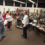 In the mechatronics engineering technology lab, visitors “talk shop” with Thomas W. Fry (right), industrial technology specialist.
