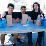Staffing the basket raffle are (from left) Phi Mu Delta brothers Matthew M. Hober, of Basking Ridge, N.J., majoring in residential construction and management: building construction technology concentration; Blake R Tyson, of Forest City, enrolled in information technology: network specialist concentration; and Daniel T. Craig, a nursing student from State College.